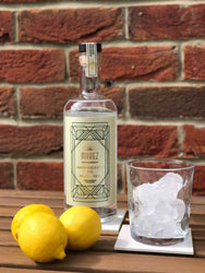 Narez Organic Vodka bottle with ice-filled glass and lemons, premium British spirit.