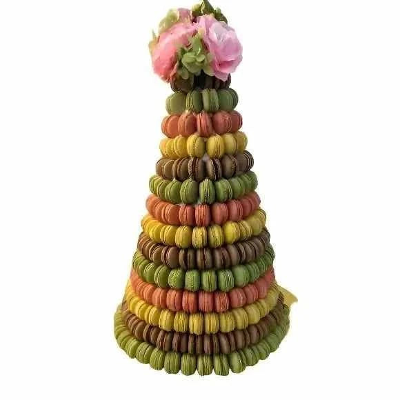 Colorful macaron tower with floral accents, perfect for celebrations and special occasions.