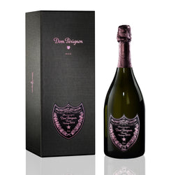 A pristine red gift box containing a bottle of Dom Pérignon Rosé Vintage 2008 champagne. The box is closed, featuring the iconic Dom Pérignon and "Rosé" branding in clean white typography.