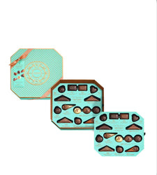 Two turquoise chocolate boxes with a variety of chocolates on a white background