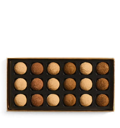 Box of assorted truffles on a white background