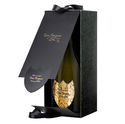 Dom Pérignon Lenny Kravitz Limited Edition Vintage 2008 Champagne presented in an open luxury dark green gift box, revealing the bottle with a gold textured shield label and black ribbon detailing.
