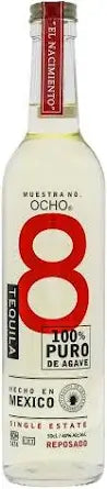 Bottle of Ocho Reposado Tequila 70cl – pale golden tequila in a clear glass bottle with a cream-colored label, lightly aged.