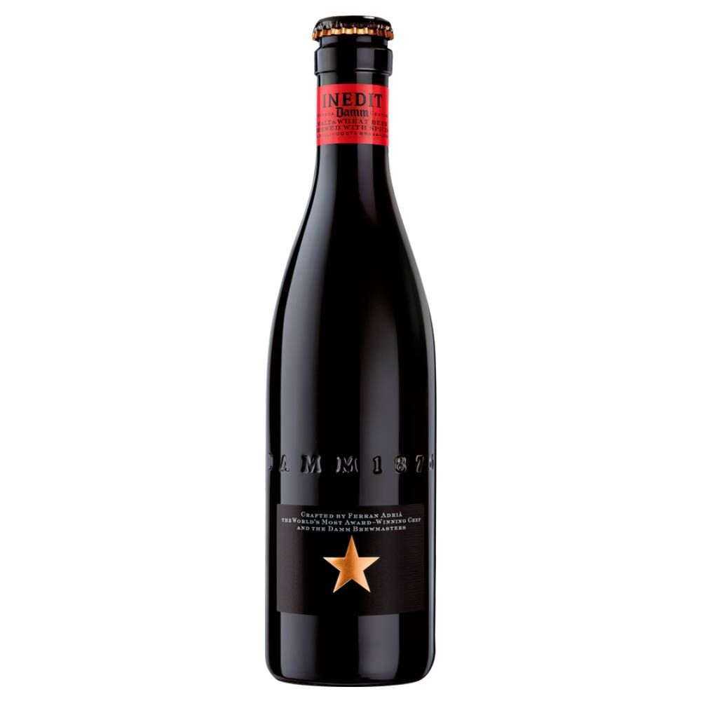 Damm Inedit Beer bottle, malt and wheat brew with spices, crafted by Ferran Adria, product of Spain.