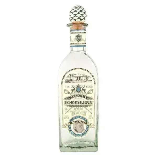 Clear bottle of Fortaleza Blanco Tequila with decorative stopper and label.