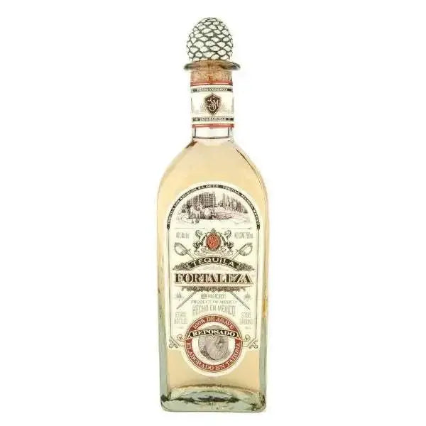 Fortaleza Reposado Tequila bottle with pinecone stopper.