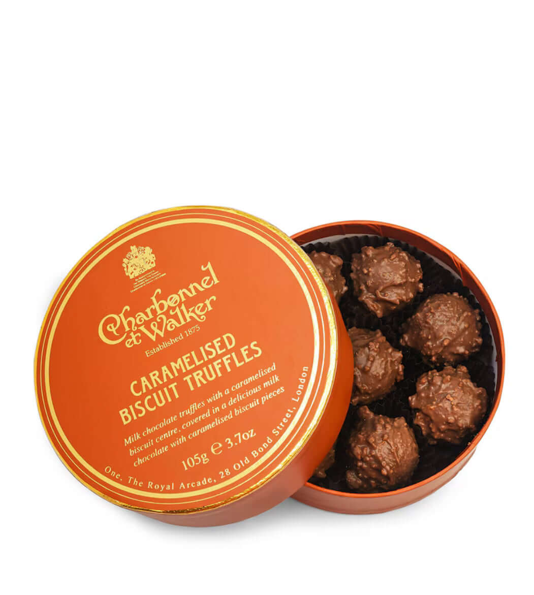 open-tin-of-charbonnel-et-walker-caramelised-biscuit-truffles-on-a-white-background