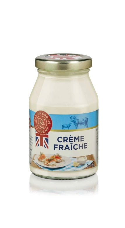 Jar of crème fraçèche with a British flag label on a white background