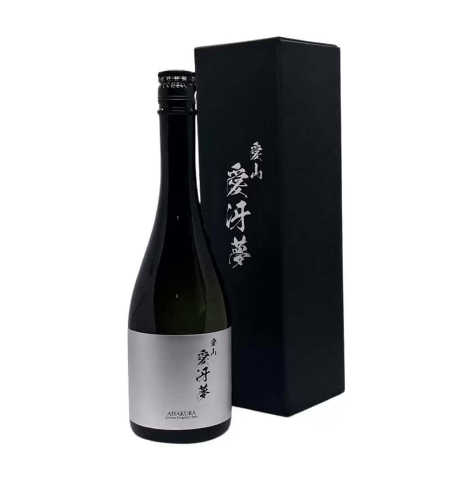 Bottle of black wine with a matching black box on a white background