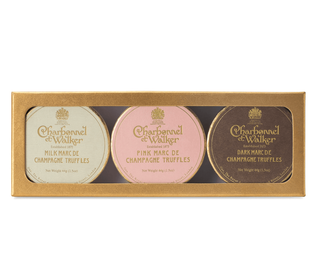 Box of Charbonnel et Walker truffles with three different flavors on a white background
