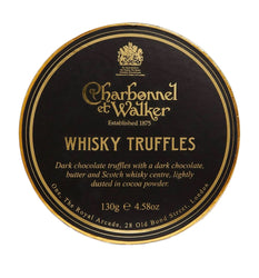 A round black and gold label for Charbonnel et Walker Whisky Truffles, photographed on a plain white background.