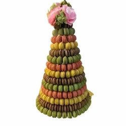Colorful macaron tower with floral accents, perfect for celebrations and special occasions.