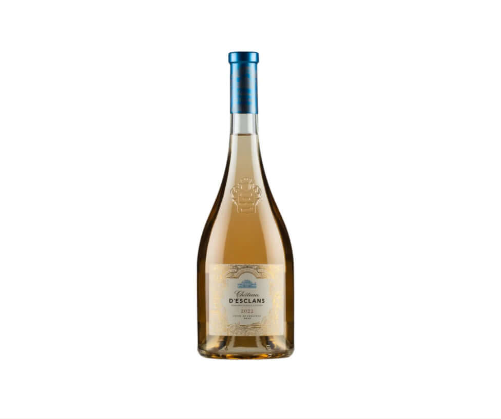 Pale salmon-pink bottle of Château d'Esclans Côtes de Provence Rosé 2022 (75cl), featuring a clear glass with elegant pale rosé wine inside. The label is cream-colored with intricate gold-embossed borders and heraldic crest at the top, reading 