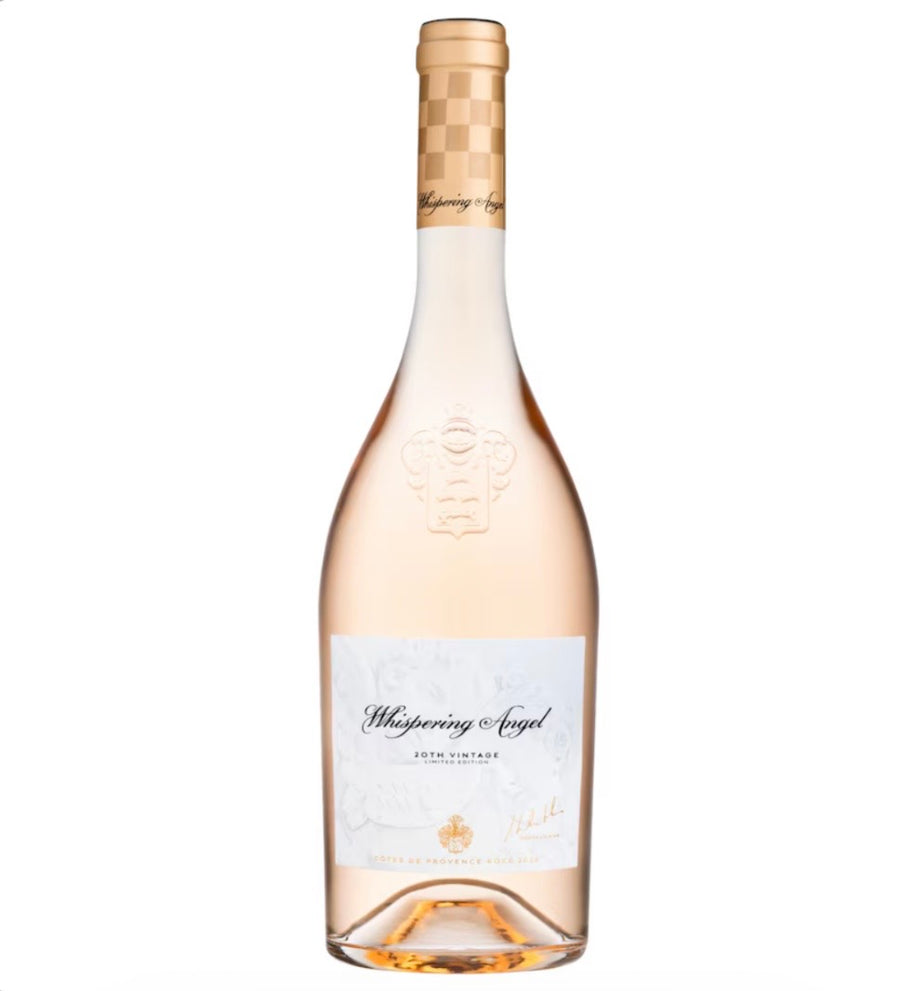 A bottle of Whispering Angel Rosé Champagne Non Alcoholic, featuring a pale pinkish-rose liquid, a white label with elegant black script, and a gold patterned neck foil, set against a plain white background.