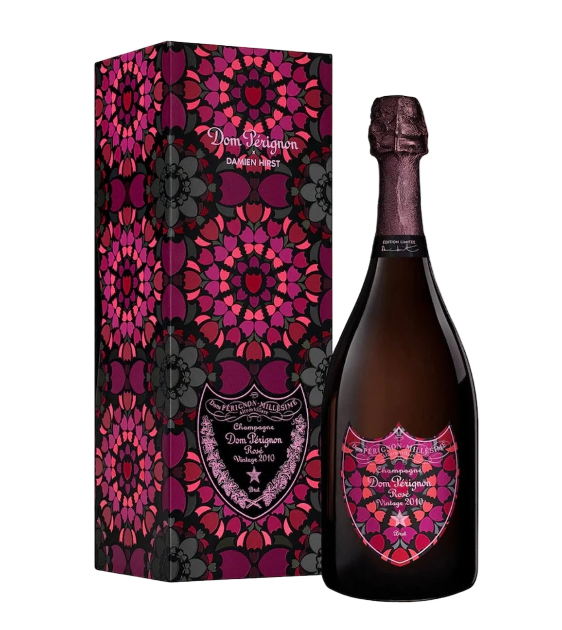 A bottle of Dom Pérignon Grand Cru Champagne next to its matching decorative gift box, both featuring a vibrant magenta, pink, and purple mandala pattern on a black background.