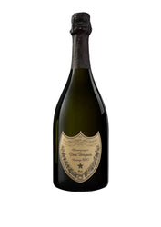 A bottle of Dom Pérignon Vintage 2017 Champagne on a clean white background. The dark green glass bottle features its signature gold shield label and a dark foil capsule with a sculpted lion head at the top.