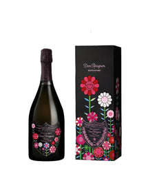 Black bottle and matching black gift box of Dom Pérignon Rosé Vintage 2010 Takashi Murakami Limited Edition (75cl). The bottle features a dark green glass with a textured pinkish-purple foil capsule and a custom label adorned with vibrant Murakami-style smiling flowers in pink, red, white, purple, and blue, surrounding the classic Dom Pérignon shield with "Dom Pérignon Rosé Vintage 2010" text.