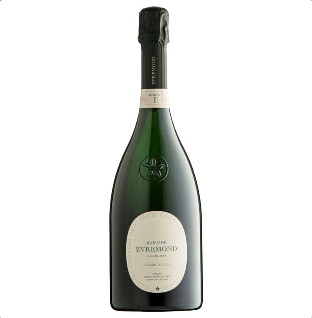 dark-green-glass-bottle-of-domaine-evremond-classic-cuvee-edition-i-english-sparkling-wine-the-bottle-features-a-black-foil-capsule-with-vertical-gold-text-evremond-a-white-neck-label-reading-edition-i-classic-cuvee-and-a-prominent-oval-white-label-framed-in-green-text-charles-de-st-denis-chevalier-de-st-evremond-around-the-edge-centrally-it-displays-domaine-evremond-chilham-kent-classic-cuvee