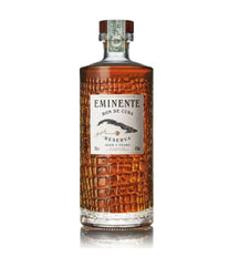 A bottle of Eminent Bon de Cuba Reserva aged 7 years rum, featuring a textured amber-brown bottle body and a cream-colored label, set against a plain white background with a subtle reflection.