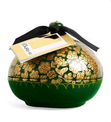 Decorative green container with gold floral patterns and a black ribbon, featuring a 'FARHI' tag.