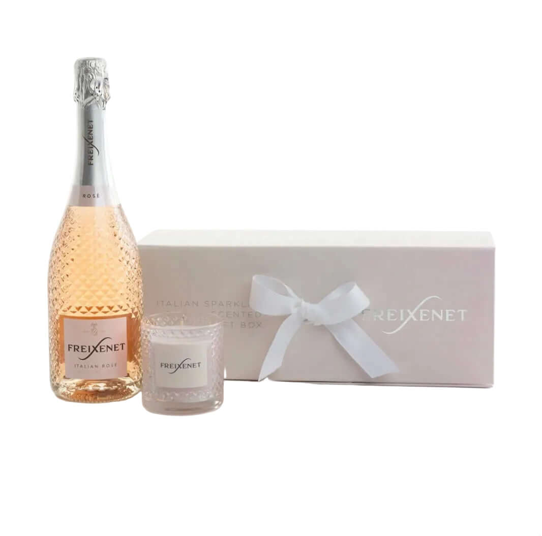 Freixenet sparkling wine bottle and glass set with a matching box on a white background