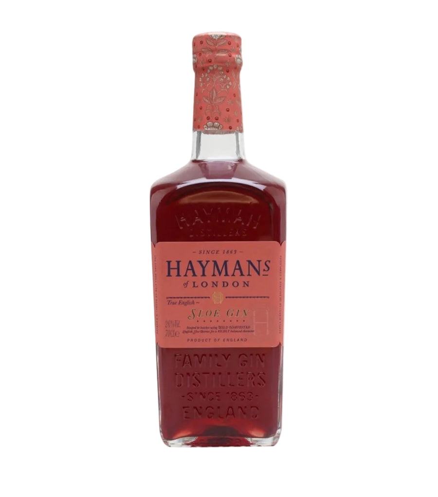 A bottle of Haymans London Sloe Gin with a pink label and a patterned pink neck wrap, set against a plain white background.