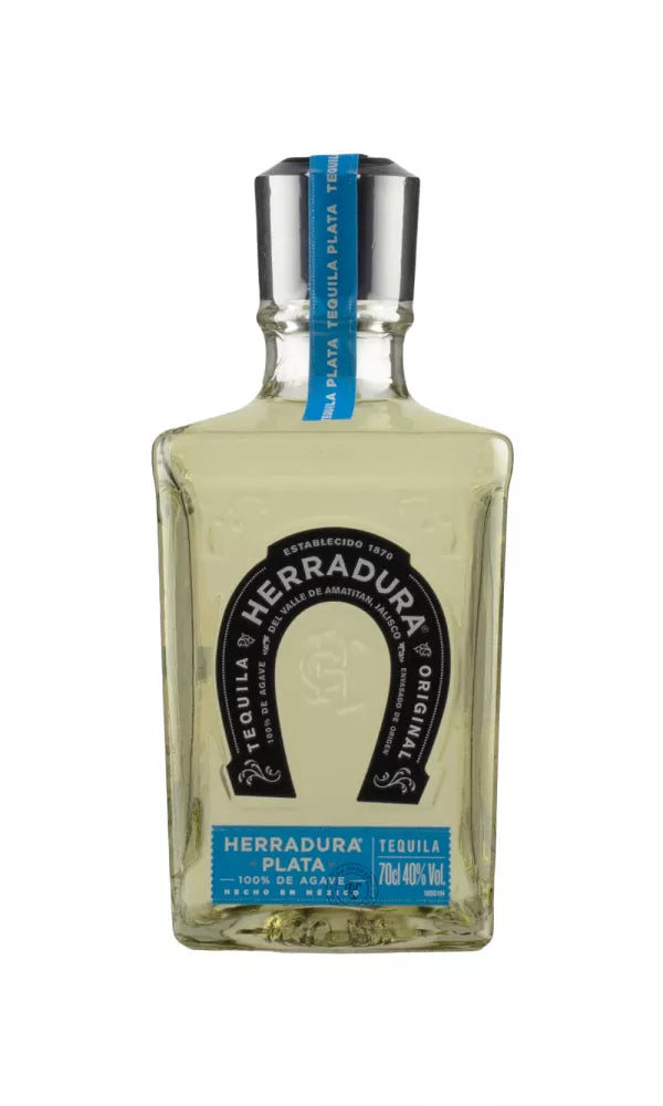 Sleek 70cl bottle of Herradura Plata Tequila, 40% ABV, with a clear, modern design. This unaged blanco tequila offers a crisp, agave-forward flavor with citrus notes.