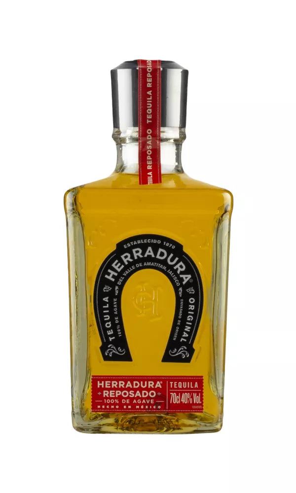 Elegant 70cl bottle of Herradura Reposado Tequila, 40% ABV, with a classic design. This golden tequila, aged 11 months, offers a smooth, rich agave and vanilla flavor.