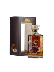 Hibiki whiskey bottle with floral design and packaging on a white background
