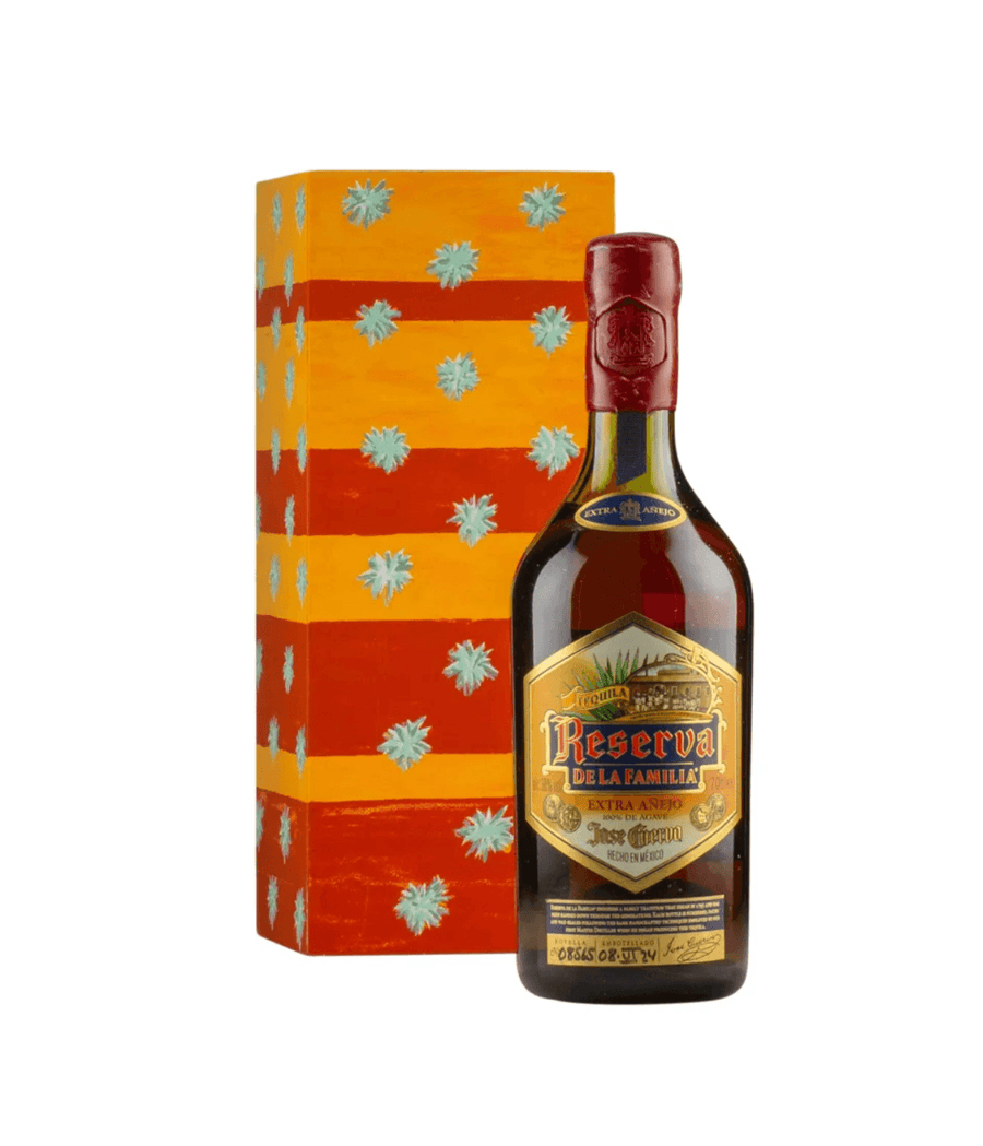 Bottle of Reserva de la Familia rum with decorative box on a white background