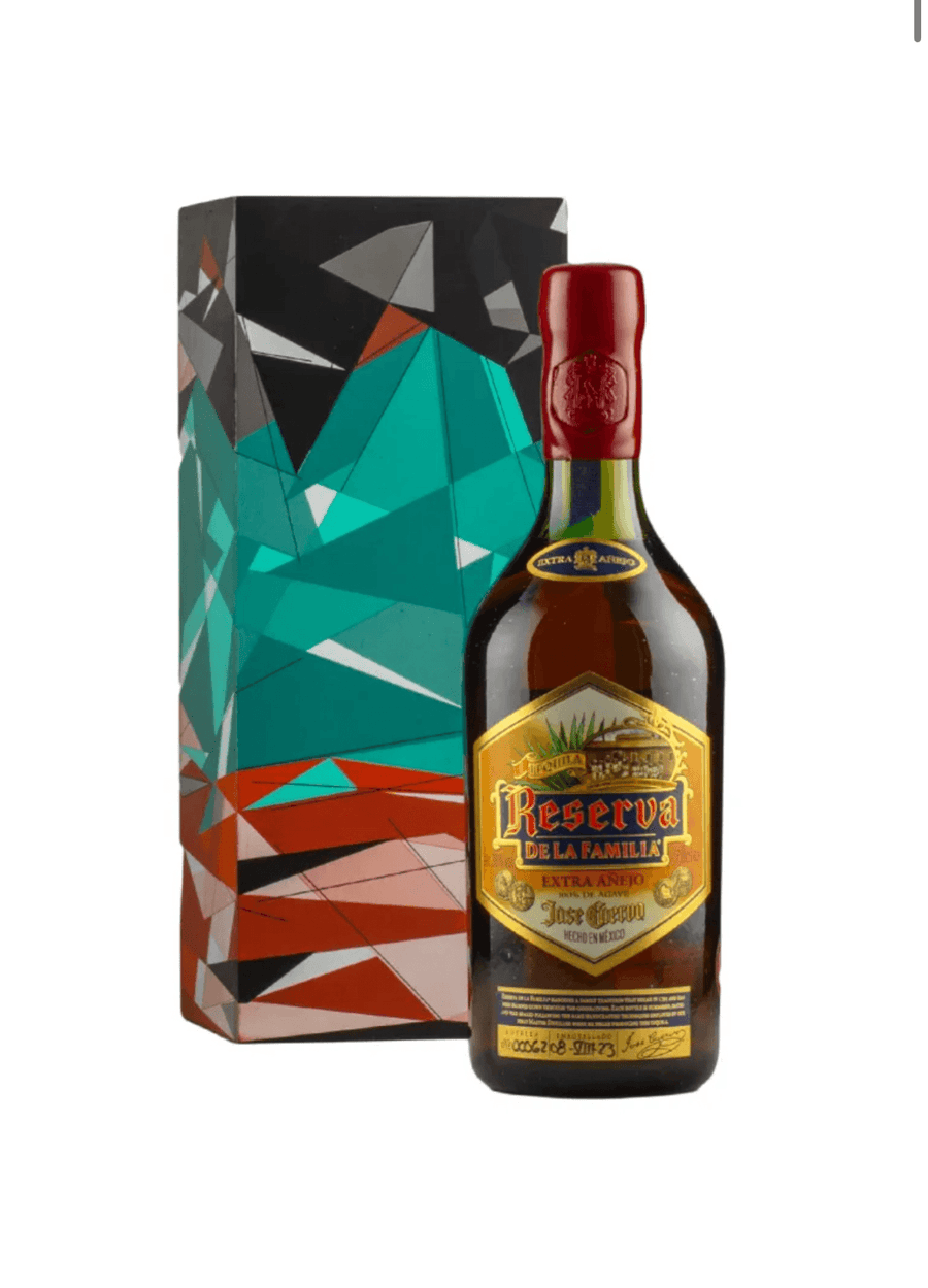 Bottle of Reserva de la Familia rum with decorative box on a white background