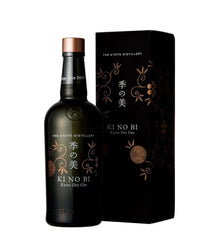 A bottle of Kyoto Distillery Ki No Bi Kyoto Dry Gin next to its black packaging box with gold floral patterns, on a white background.