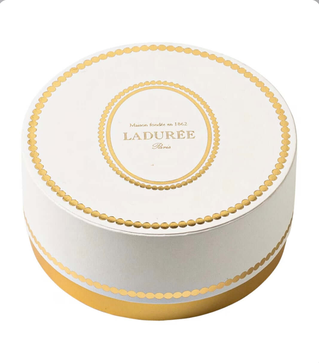 round-white-and-gold-ladere-box-on-a-white-background