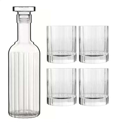 A clear ribbed glass decanter with a stopper next to four matching clear ribbed glass tumblers on a white background.