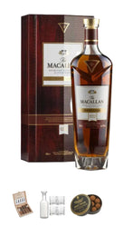 The Macallan Rare Single Malts Scotch Whisky bottle with its dark red gift box, plus a small gift set including a decanter, four whisky glasses, Charbonnel et walker Whisky truffle Chocolates 130g and a Davidoff Cigar selection box 