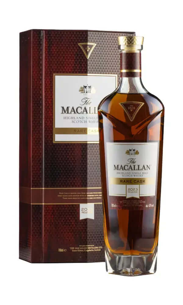 A bottle of The Macallan Rare Single Malt Scotch Whisky stands in front of its dark red textured presentation box on a plain white background.