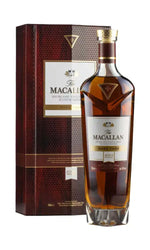 A bottle of The Macallan Rare Single Malt Scotch Whisky stands in front of its dark red textured presentation box on a plain white background.