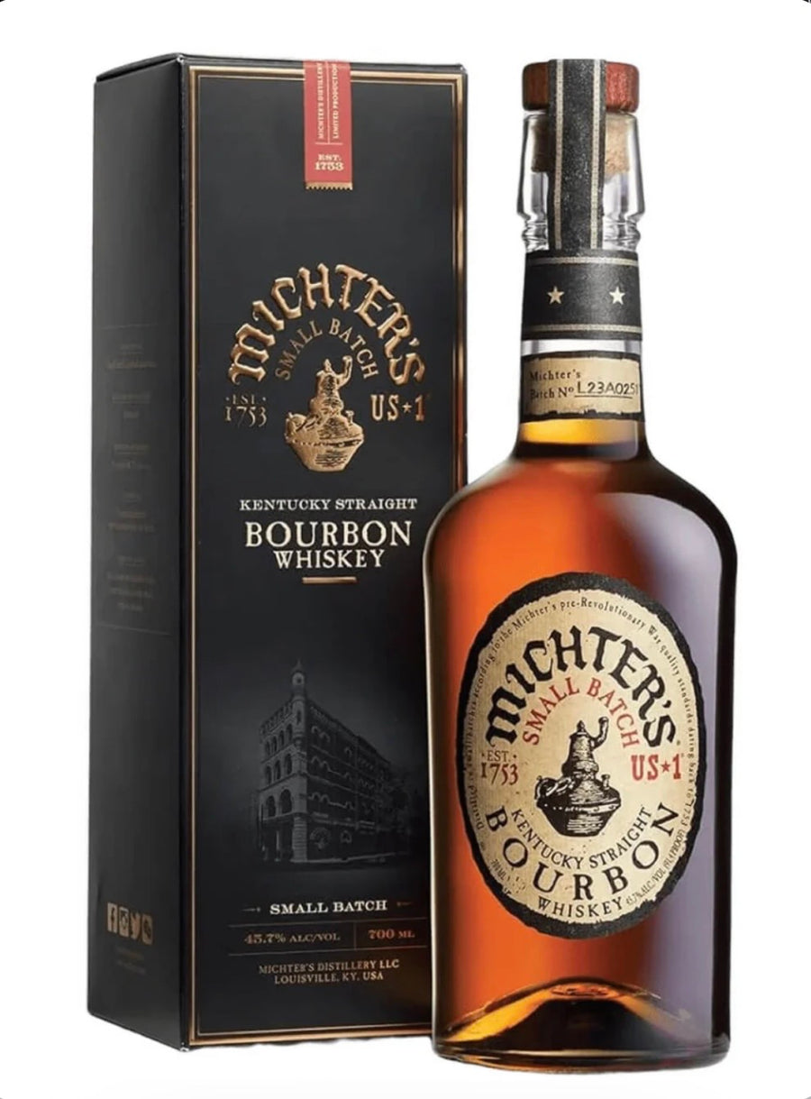 A bottle of Michters Small Batch Kentucky Straight Bourbon Whiskey next to its black packaging box, displayed on a clean white background.