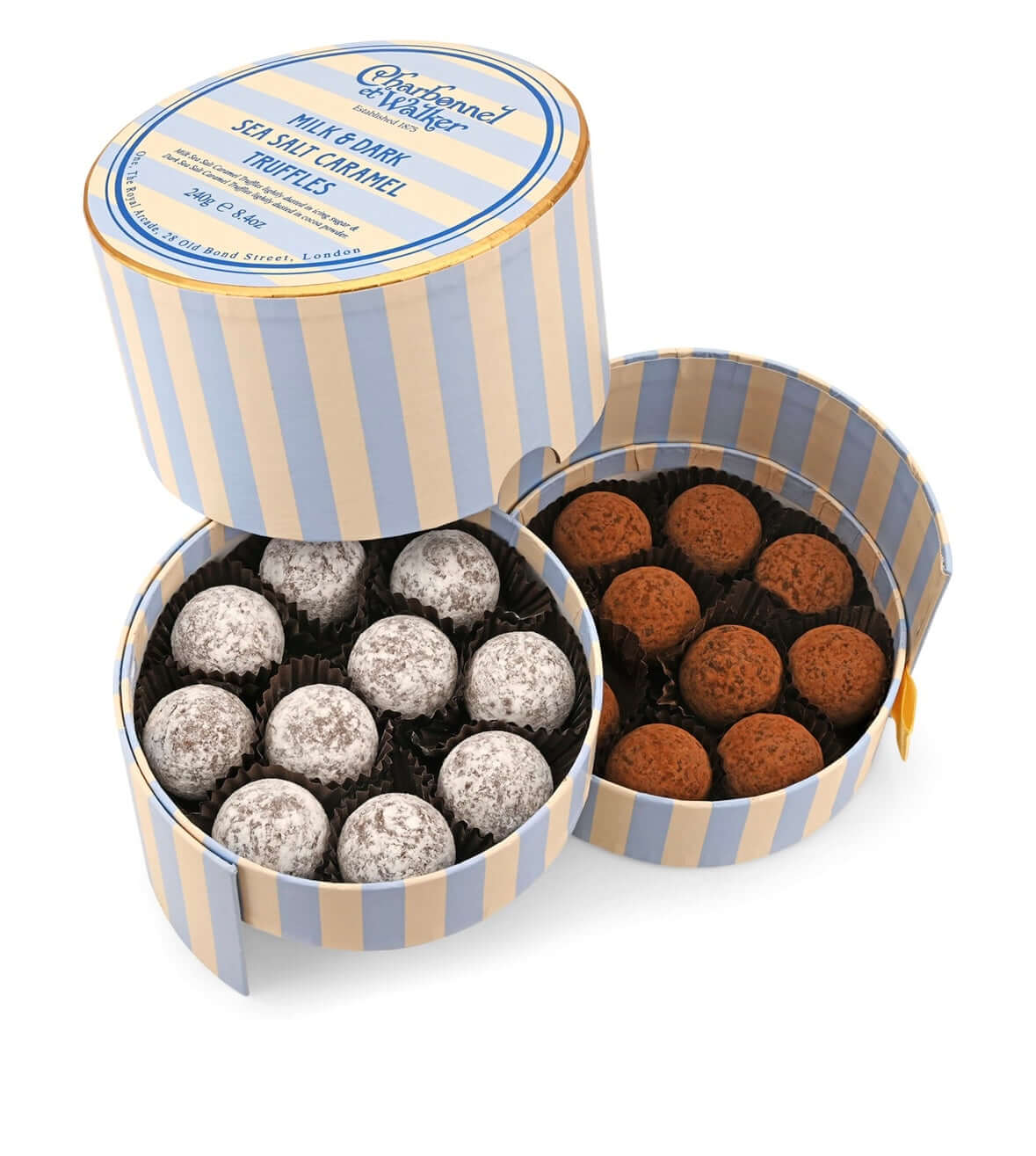 Two round boxes of chocolate truffles with striped design on a white background