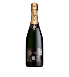 A bottle of Moët & Chandon Non Alcoholic Sparkling Wine, shown from the back against a plain white background. The bottle is dark green glass with a gold foil capsule and a black label.