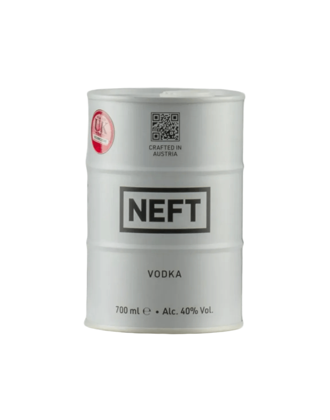 White cylindrical metal barrel-shaped bottle of NEFT premium Austrian vodka, mimicking an oil drum design. The barrel features bold black text: "NEFT" prominently in the center band, "VODKA" below it, and "700 ml e • Alc. 40% Vol." at the bottom. Additional text includes "CRAFTED IN AUSTRIA"