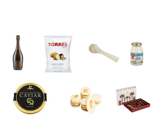 Collection of gourmet items including an alcohol free bottle of Sparkling wine, Caviar, Qinwan Dates and other food products on a white background.