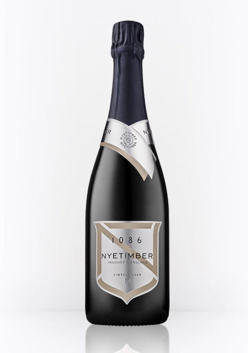 Dark bottle of Nyetimber 1086 Vintage 2009 English sparkling wine (75cl / 750ml). The bottle has a deep navy foil capsule, a silver neck band with "NYETIMBER" in black, and a large silver-and-beige shield label featuring "1086" at the top, "NYETIMBER" in elegant script, "VINTAGE 2009", "PRODUCT OF ENGLAND", and "QUALITY SPARKLING WINE GROWN & PRODUCED BY NYETIMBER WEST CHILTINGTON, UK" in fine print.