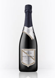 Dark bottle of Nyetimber 1086 Vintage 2009 English sparkling wine (75cl / 750ml). The bottle has a deep navy foil capsule, a silver neck band with "NYETIMBER" in black, and a large silver-and-beige shield label featuring "1086" at the top, "NYETIMBER" in elegant script, "VINTAGE 2009", "PRODUCT OF ENGLAND", and "QUALITY SPARKLING WINE GROWN & PRODUCED BY NYETIMBER WEST CHILTINGTON, UK" in fine print.