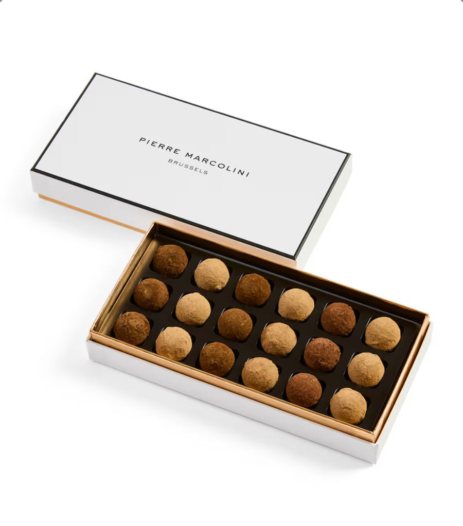 Box of truffles with Pierre Marcolini branding on a white background