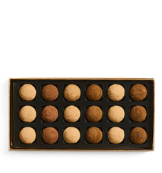 Box of assorted truffles on a white background