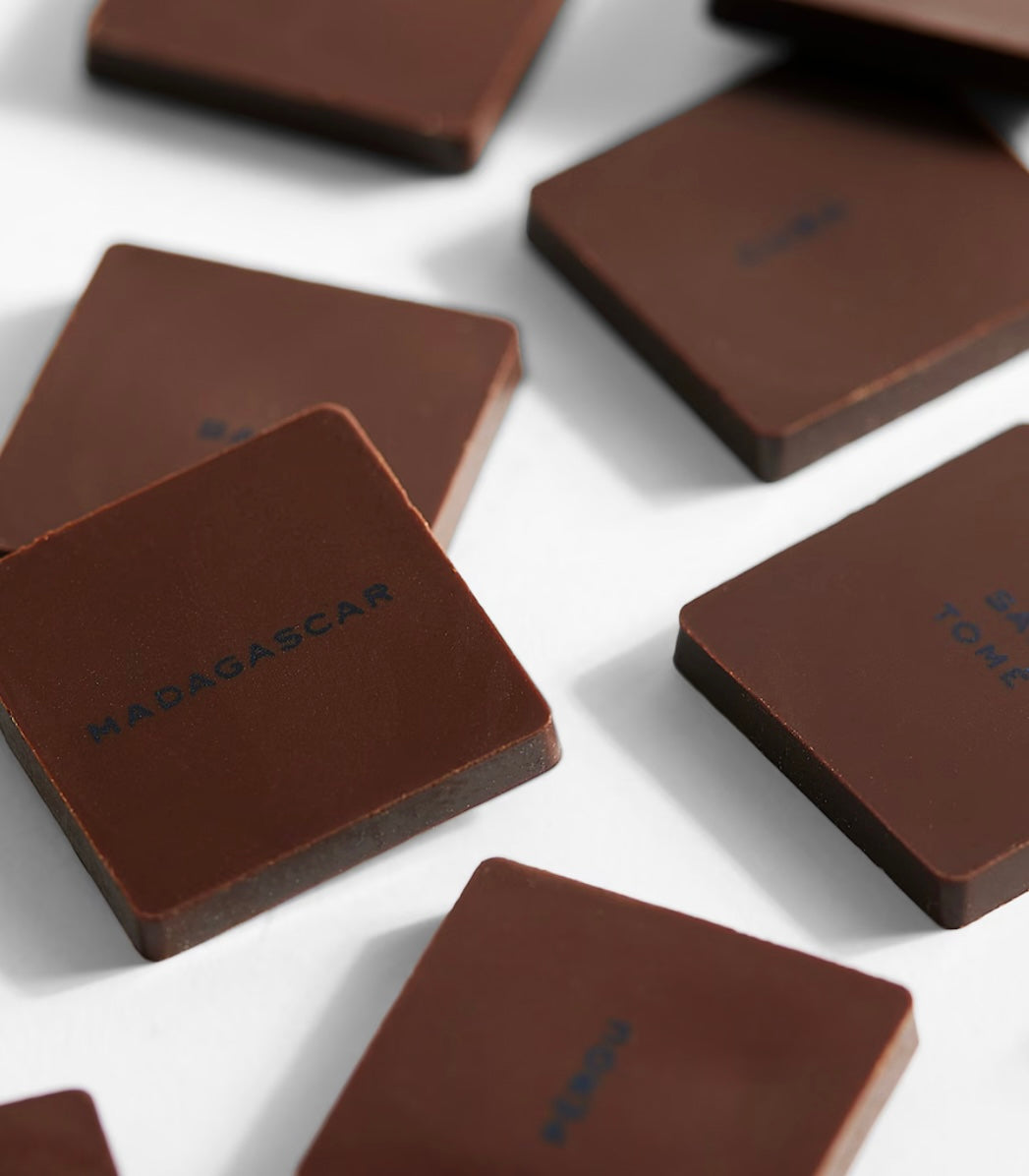 Dark chocolate bars with 'Madagascar' branding on a white surface