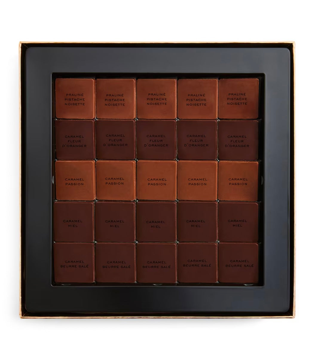 Box of Chanel Caramel Fashion chocolate bars on a white background