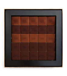 Box of Chanel Caramel Fashion chocolate bars on a white background