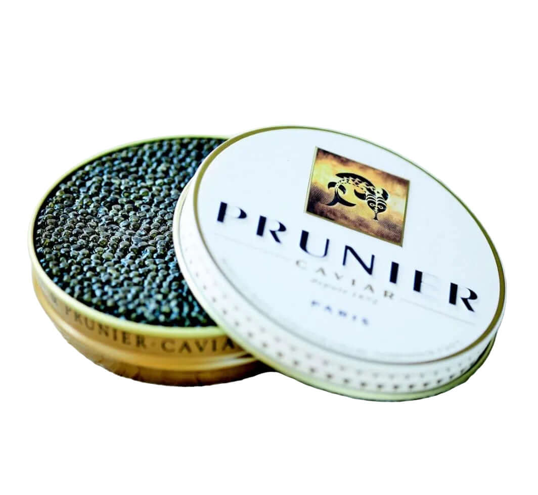 Open container of Prunier caviar on a light wooden surface